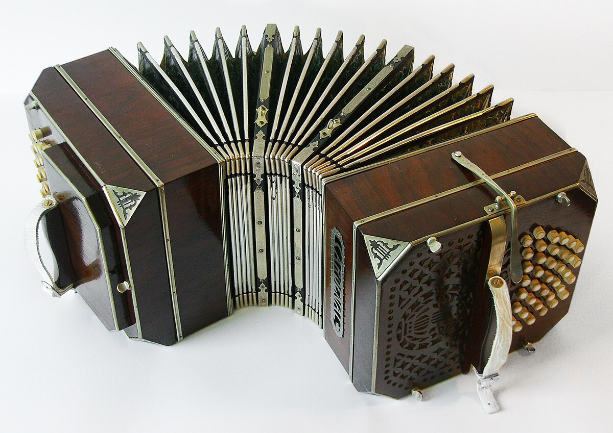 A square squeezebox instrument with buttons on the sides