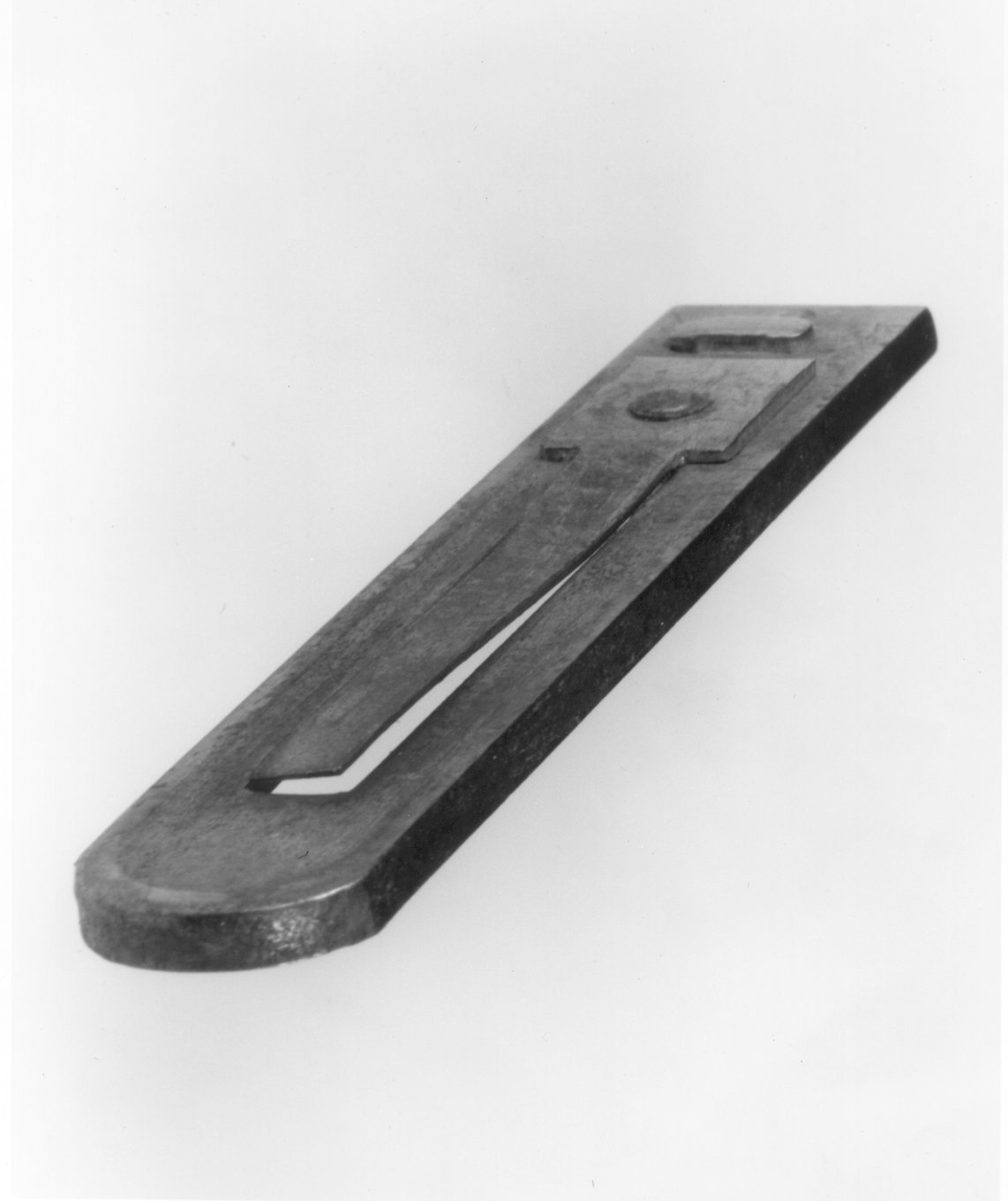 A small metal reed in its frame