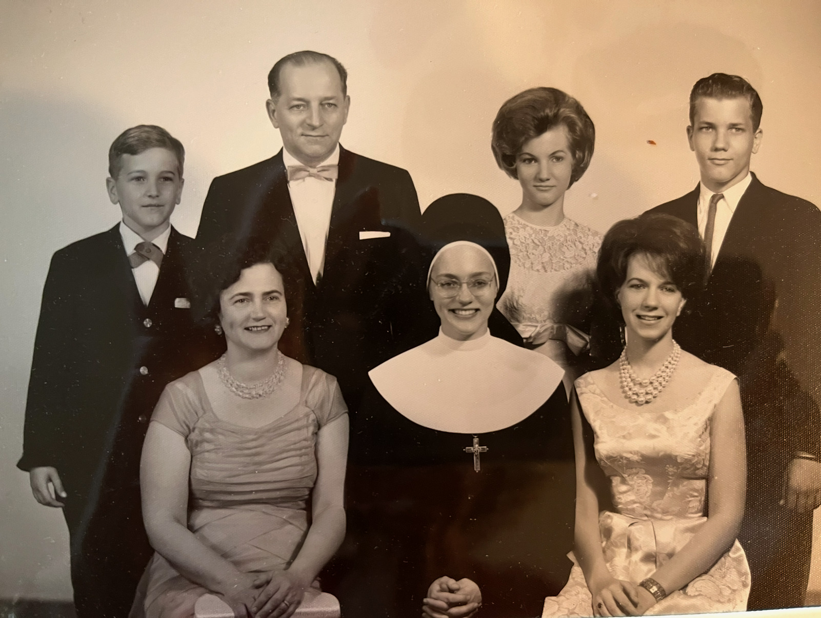 (Black and white) A family of seven all dressed up for a nice photo.